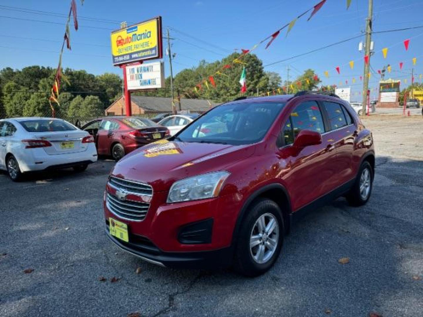 2015 Red Chevrolet Trax LT FWD (KL7CJLSBXFB) with an 1.4L L4 DOHC 16V engine, 6-Speed Automatic transmission, located at 1806 Veterans Memorial Hwy SW, Austell, GA, 30168, (770) 944-9558, 33.817959, -84.606987 - Photo#0