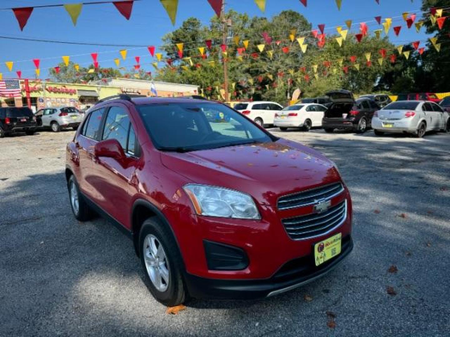 2015 Red Chevrolet Trax LT FWD (KL7CJLSBXFB) with an 1.4L L4 DOHC 16V engine, 6-Speed Automatic transmission, located at 1806 Veterans Memorial Hwy SW, Austell, GA, 30168, (770) 944-9558, 33.817959, -84.606987 - Photo#2