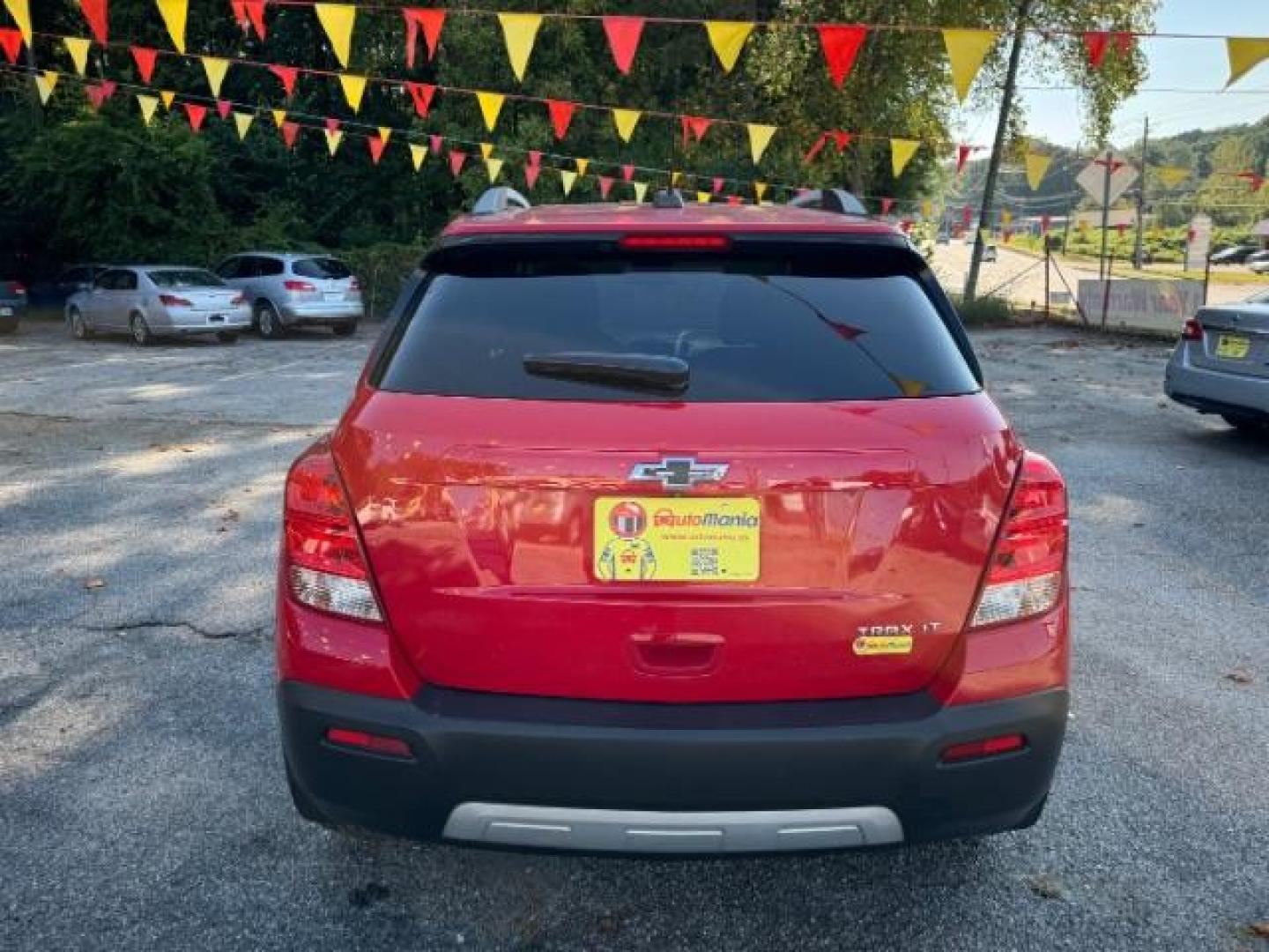 2015 Red Chevrolet Trax LT FWD (KL7CJLSBXFB) with an 1.4L L4 DOHC 16V engine, 6-Speed Automatic transmission, located at 1806 Veterans Memorial Hwy SW, Austell, GA, 30168, (770) 944-9558, 33.817959, -84.606987 - Photo#4