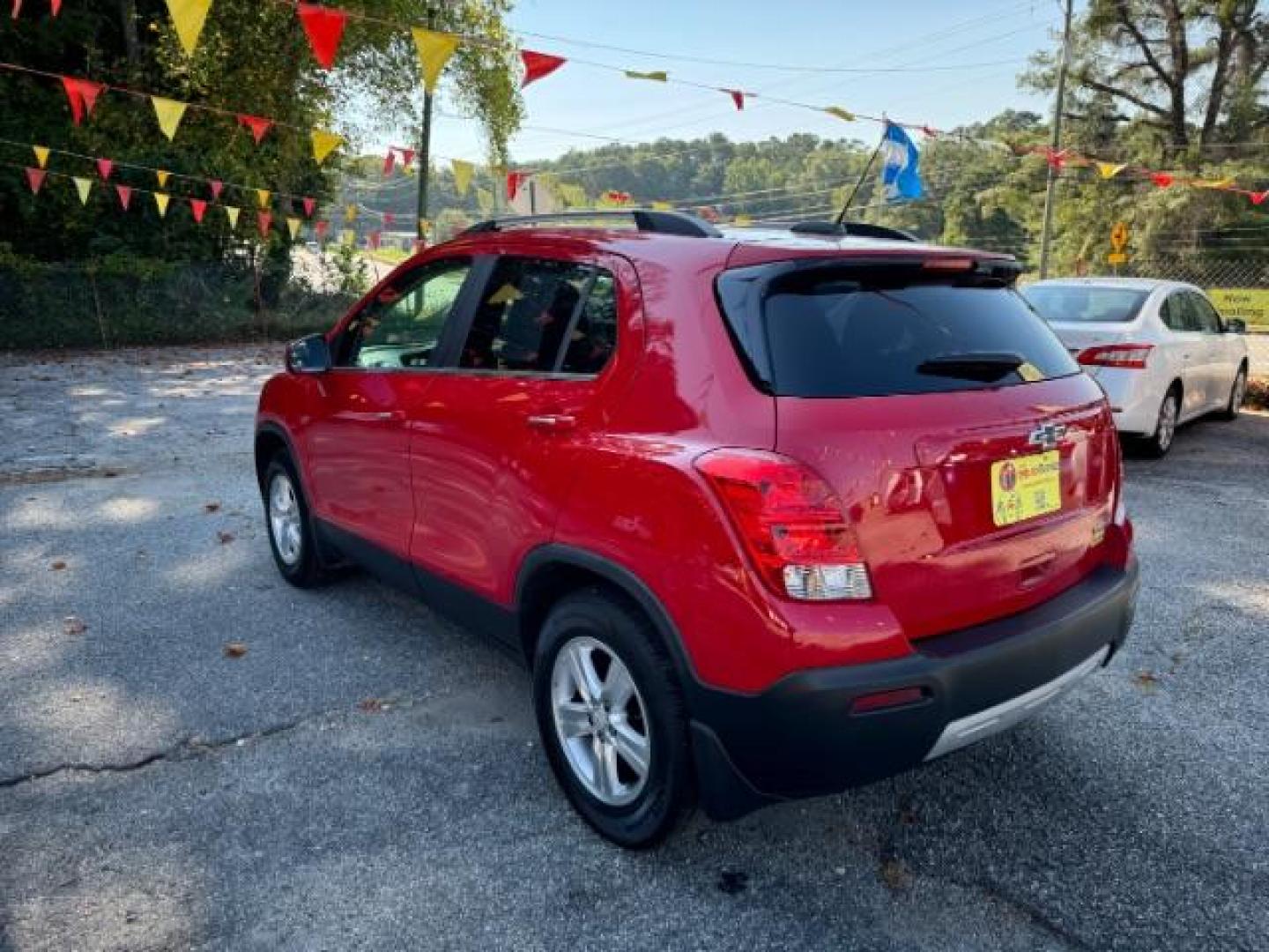 2015 Red Chevrolet Trax LT FWD (KL7CJLSBXFB) with an 1.4L L4 DOHC 16V engine, 6-Speed Automatic transmission, located at 1806 Veterans Memorial Hwy SW, Austell, GA, 30168, (770) 944-9558, 33.817959, -84.606987 - Photo#5