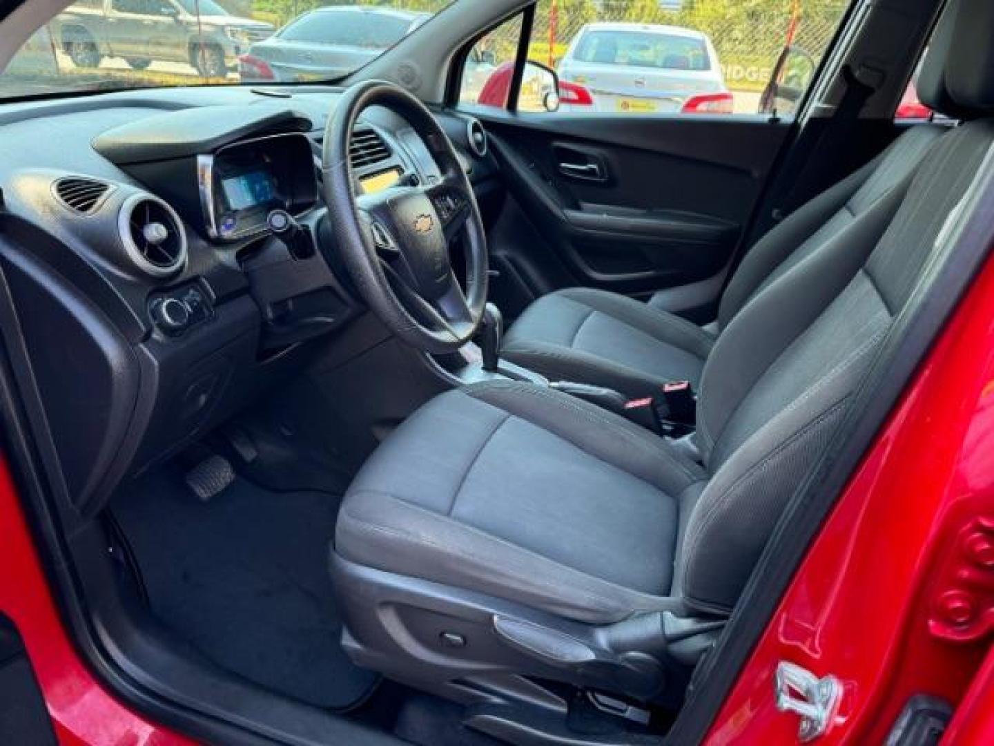 2015 Red Chevrolet Trax LT FWD (KL7CJLSBXFB) with an 1.4L L4 DOHC 16V engine, 6-Speed Automatic transmission, located at 1806 Veterans Memorial Hwy SW, Austell, GA, 30168, (770) 944-9558, 33.817959, -84.606987 - Photo#6