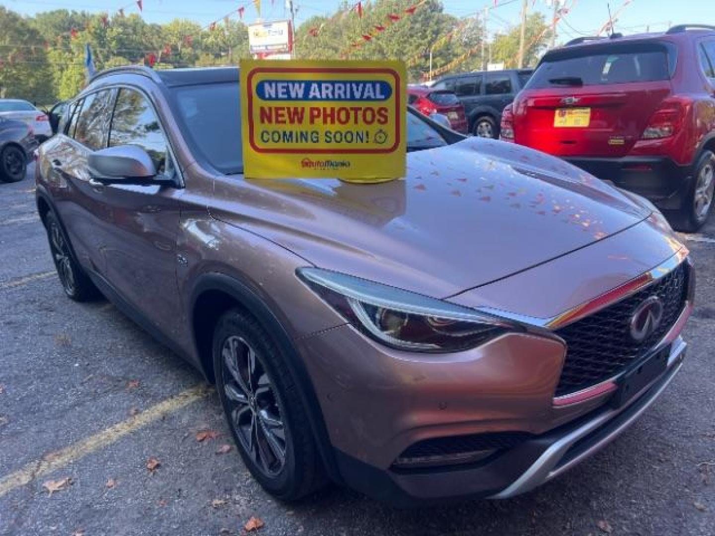 2017 Gold Infiniti QX30 Premium AWD (SJKCH5CR8HA) with an 2.0L L4 DOHC 16V engine, 7-Speed Automatic transmission, located at 1806 Veterans Memorial Hwy SW, Austell, GA, 30168, (770) 944-9558, 33.817959, -84.606987 - Photo#0