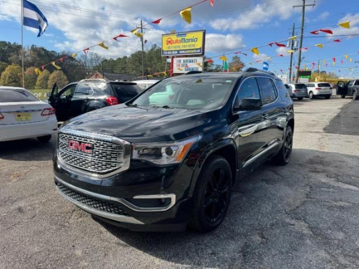 2017 Black GMC Acadia Denali AWD (1GKKNXLS4HZ) with an 3.6L V6 DOHC 24V engine, 6-Speed Automatic transmission, located at 1806 Veterans Memorial Hwy SW, Austell, GA, 30168, (770) 944-9558, 33.817959, -84.606987 - Photo#0