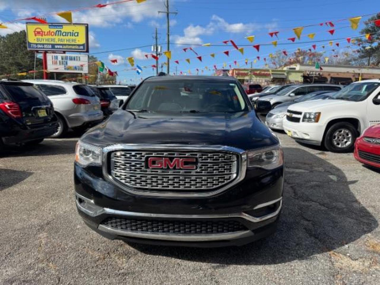 2017 Black GMC Acadia Denali AWD (1GKKNXLS4HZ) with an 3.6L V6 DOHC 24V engine, 6-Speed Automatic transmission, located at 1806 Veterans Memorial Hwy SW, Austell, GA, 30168, (770) 944-9558, 33.817959, -84.606987 - Photo#1