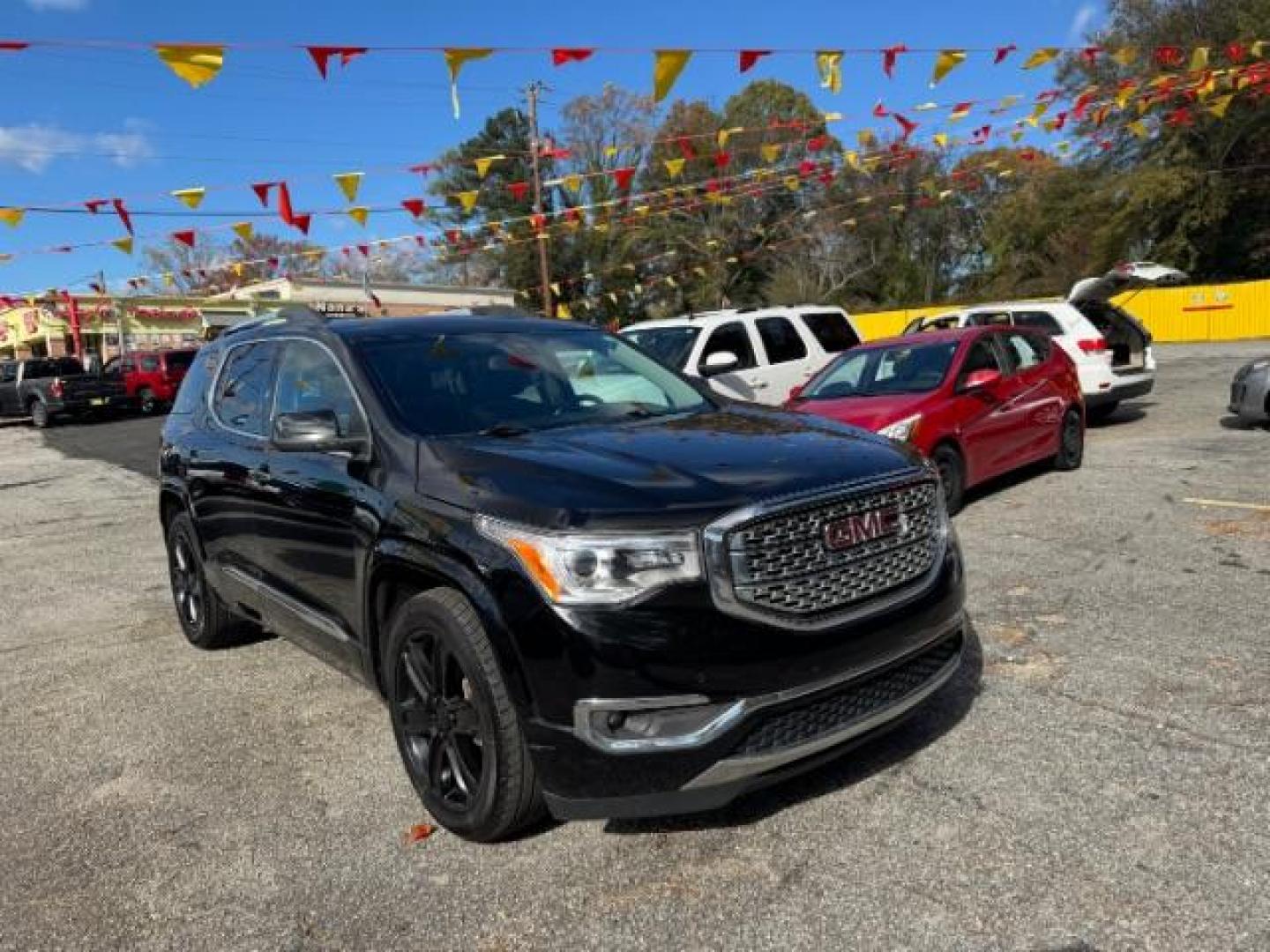 2017 Black GMC Acadia Denali AWD (1GKKNXLS4HZ) with an 3.6L V6 DOHC 24V engine, 6-Speed Automatic transmission, located at 1806 Veterans Memorial Hwy SW, Austell, GA, 30168, (770) 944-9558, 33.817959, -84.606987 - Photo#2