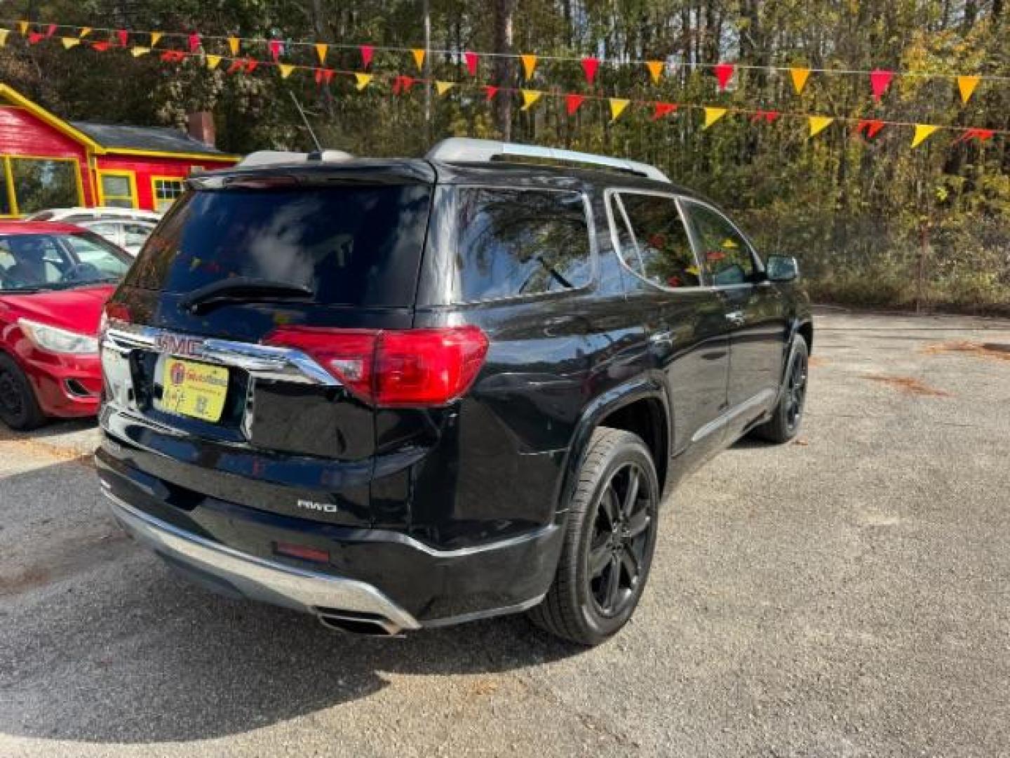 2017 Black GMC Acadia Denali AWD (1GKKNXLS4HZ) with an 3.6L V6 DOHC 24V engine, 6-Speed Automatic transmission, located at 1806 Veterans Memorial Hwy SW, Austell, GA, 30168, (770) 944-9558, 33.817959, -84.606987 - Photo#4