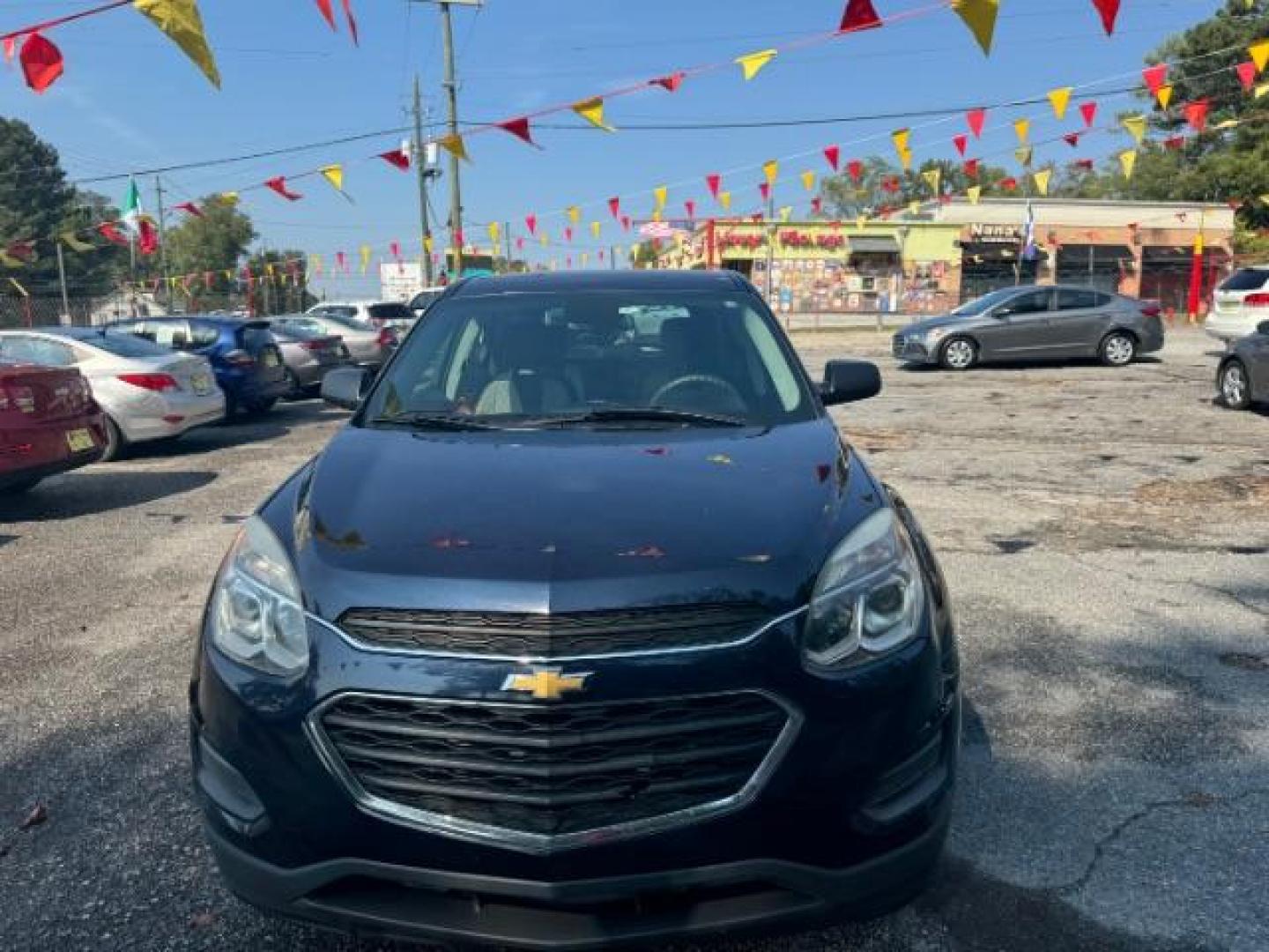 2017 Blue Chevrolet Equinox LS 2WD (2GNALBEK1H1) with an 2.4L L4 DOHC 16V FFV engine, 6-Speed Automatic transmission, located at 1806 Veterans Memorial Hwy SW, Austell, GA, 30168, (770) 944-9558, 33.817959, -84.606987 - Photo#2