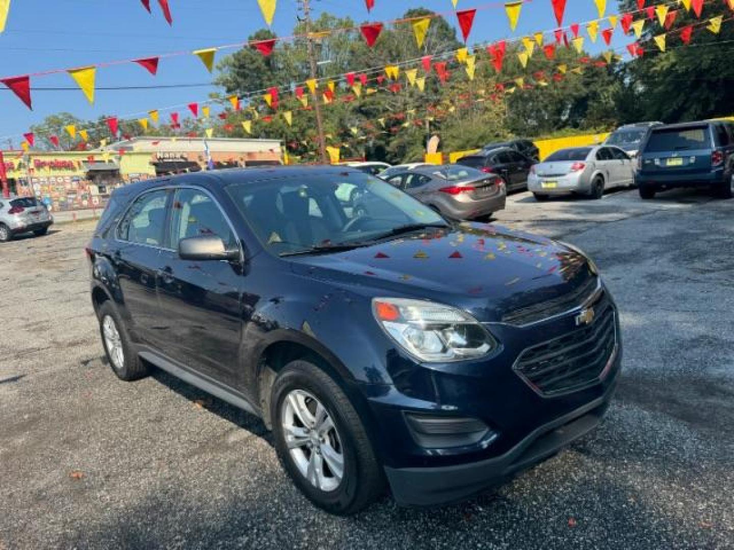 2017 Blue Chevrolet Equinox LS 2WD (2GNALBEK1H1) with an 2.4L L4 DOHC 16V FFV engine, 6-Speed Automatic transmission, located at 1806 Veterans Memorial Hwy SW, Austell, GA, 30168, (770) 944-9558, 33.817959, -84.606987 - Photo#3