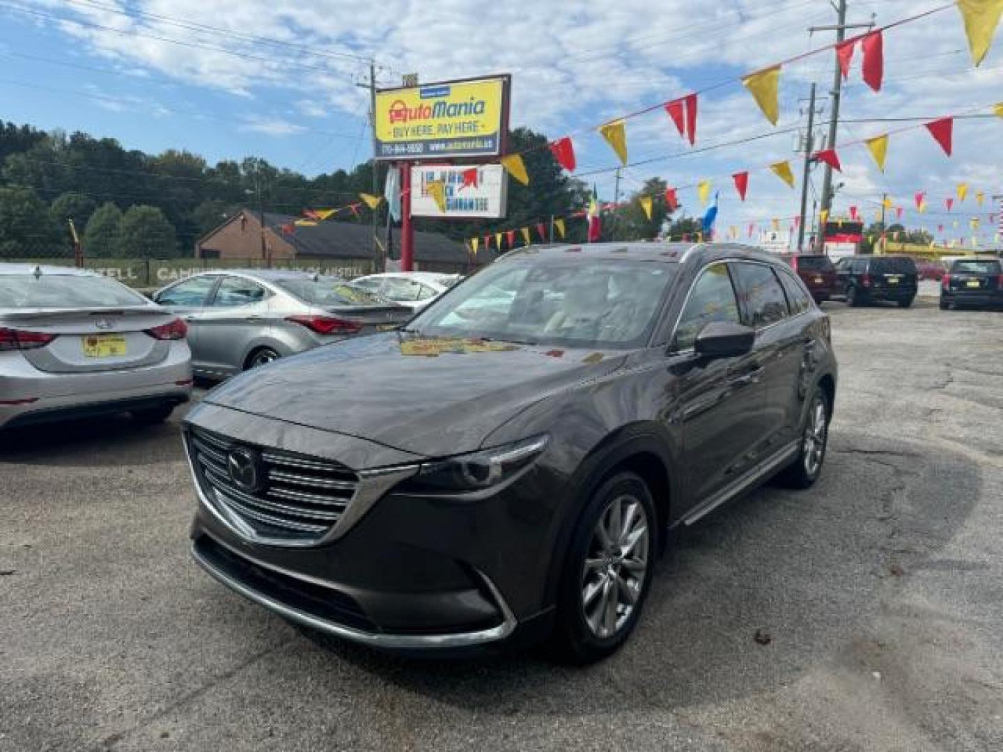 2017 Brown Mazda CX-9 Grand Touring AWD (JM3TCBDY3H0) with an 2.5L L4 DOHC 16V engine, 6-Speed Automatic transmission, located at 1806 Veterans Memorial Hwy SW, Austell, GA, 30168, (770) 944-9558, 33.817959, -84.606987 - Photo#0