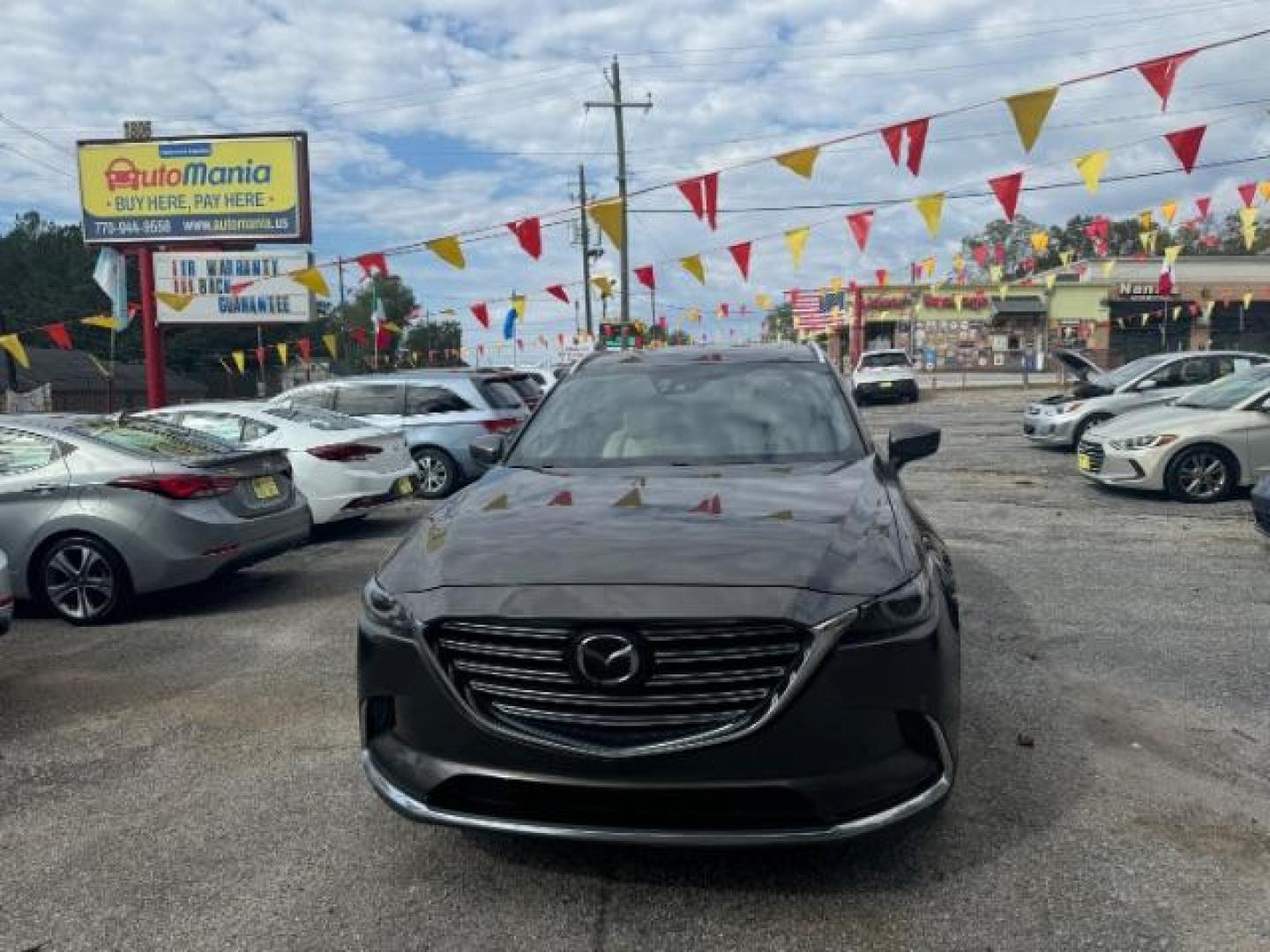 2017 Brown Mazda CX-9 Grand Touring AWD (JM3TCBDY3H0) with an 2.5L L4 DOHC 16V engine, 6-Speed Automatic transmission, located at 1806 Veterans Memorial Hwy SW, Austell, GA, 30168, (770) 944-9558, 33.817959, -84.606987 - Photo#1