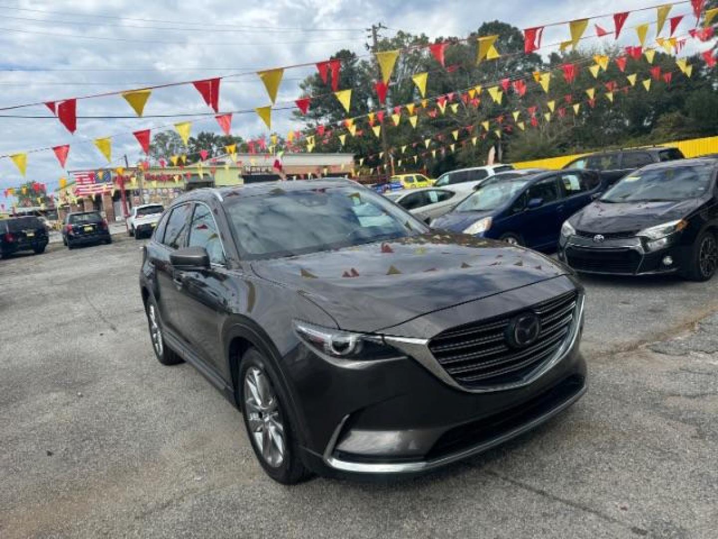 2017 Brown Mazda CX-9 Grand Touring AWD (JM3TCBDY3H0) with an 2.5L L4 DOHC 16V engine, 6-Speed Automatic transmission, located at 1806 Veterans Memorial Hwy SW, Austell, GA, 30168, (770) 944-9558, 33.817959, -84.606987 - Photo#2