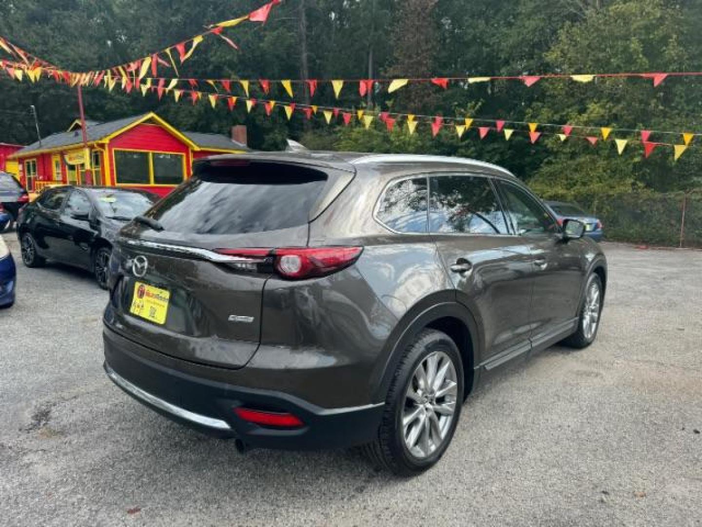 2017 Brown Mazda CX-9 Grand Touring AWD (JM3TCBDY3H0) with an 2.5L L4 DOHC 16V engine, 6-Speed Automatic transmission, located at 1806 Veterans Memorial Hwy SW, Austell, GA, 30168, (770) 944-9558, 33.817959, -84.606987 - Photo#3