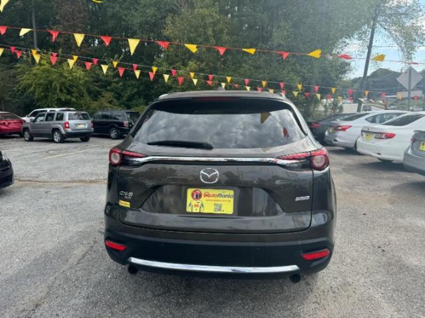 2017 Brown Mazda CX-9 Grand Touring AWD (JM3TCBDY3H0) with an 2.5L L4 DOHC 16V engine, 6-Speed Automatic transmission, located at 1806 Veterans Memorial Hwy SW, Austell, GA, 30168, (770) 944-9558, 33.817959, -84.606987 - Photo#4