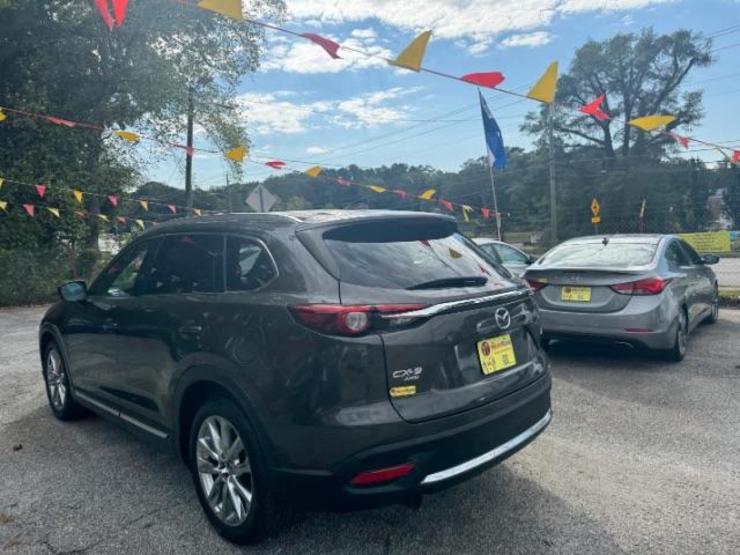 2017 Brown Mazda CX-9 Grand Touring AWD (JM3TCBDY3H0) with an 2.5L L4 DOHC 16V engine, 6-Speed Automatic transmission, located at 1806 Veterans Memorial Hwy SW, Austell, GA, 30168, (770) 944-9558, 33.817959, -84.606987 - Photo#5