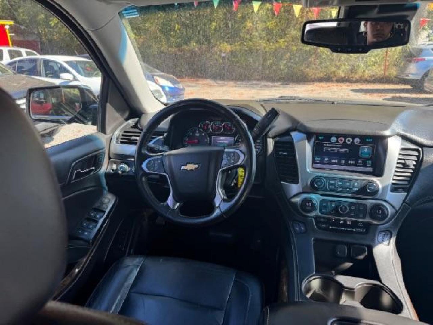 2016 Black Chevrolet Tahoe LT 4WD (1GNSKBKC9GR) with an 5.3L V8 OHV 16V engine, 6-Speed Automatic transmission, located at 1806 Veterans Memorial Hwy SW, Austell, GA, 30168, (770) 944-9558, 33.817959, -84.606987 - Photo#12