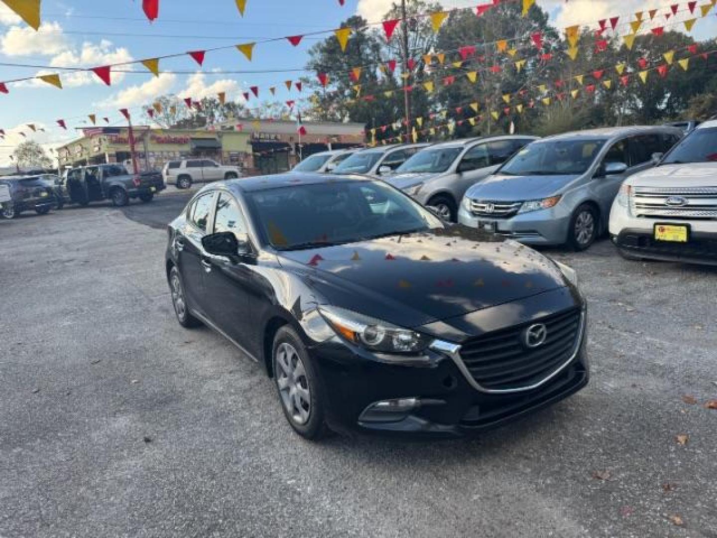 2017 Black Mazda MAZDA3 i Sport AT 4-Door (3MZBN1U75HM) with an 2.0L L4 DOHC 16V engine, 6-Speed Automatic transmission, located at 1806 Veterans Memorial Hwy SW, Austell, GA, 30168, (770) 944-9558, 33.817959, -84.606987 - Photo#2