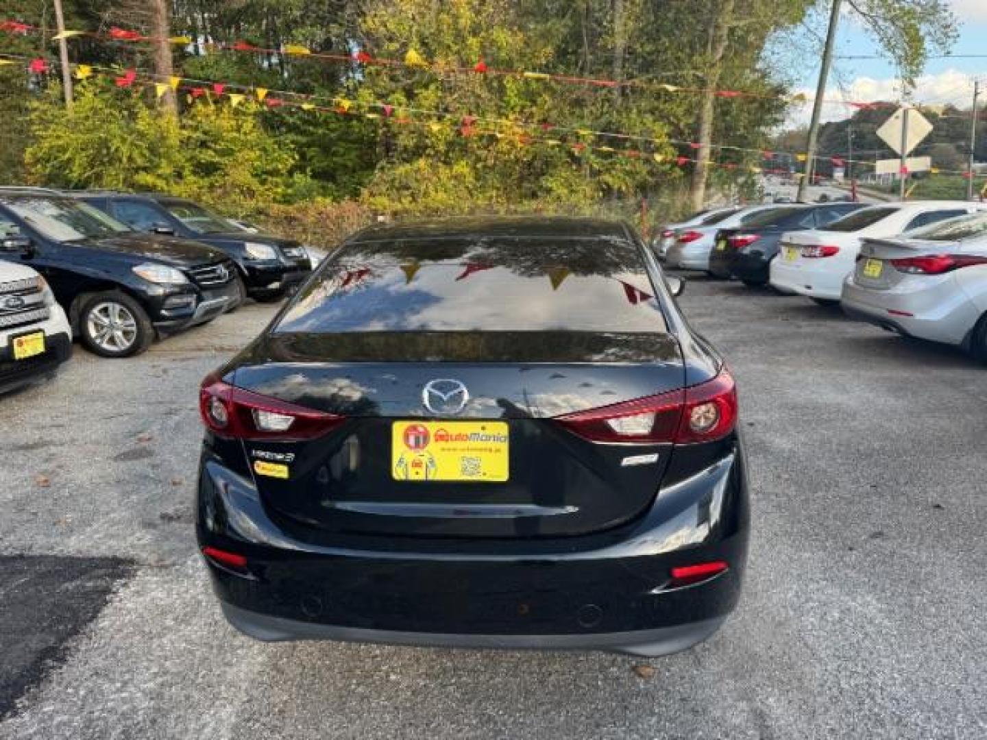 2017 Black Mazda MAZDA3 i Sport AT 4-Door (3MZBN1U75HM) with an 2.0L L4 DOHC 16V engine, 6-Speed Automatic transmission, located at 1806 Veterans Memorial Hwy SW, Austell, GA, 30168, (770) 944-9558, 33.817959, -84.606987 - Photo#4