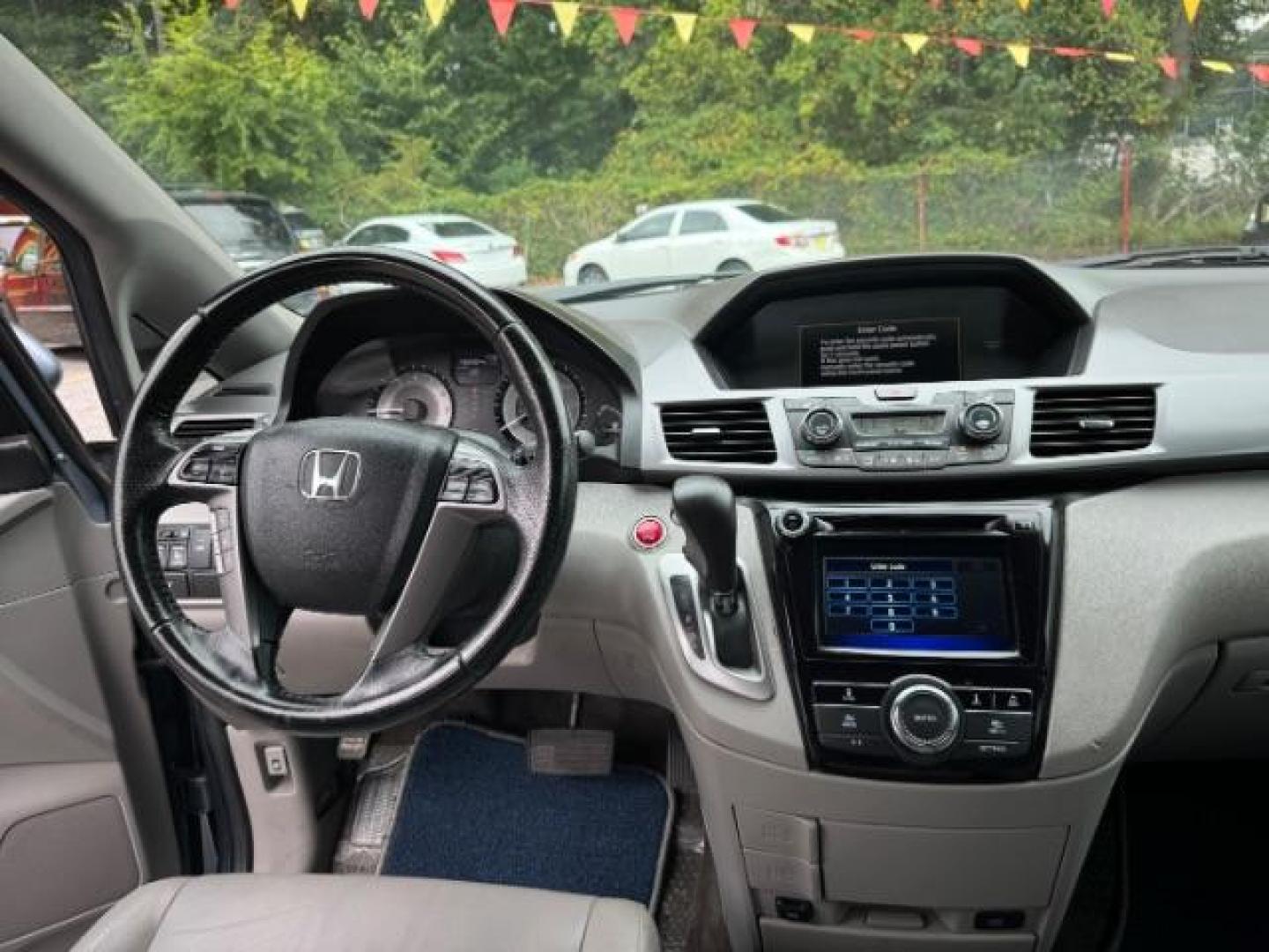 2014 Blue Honda Odyssey EX-L (5FNRL5H61EB) with an 3.5L V6 SOHC 24V engine, 6-Speed Automatic transmission, located at 1806 Veterans Memorial Hwy SW, Austell, GA, 30168, (770) 944-9558, 33.817959, -84.606987 - Photo#12