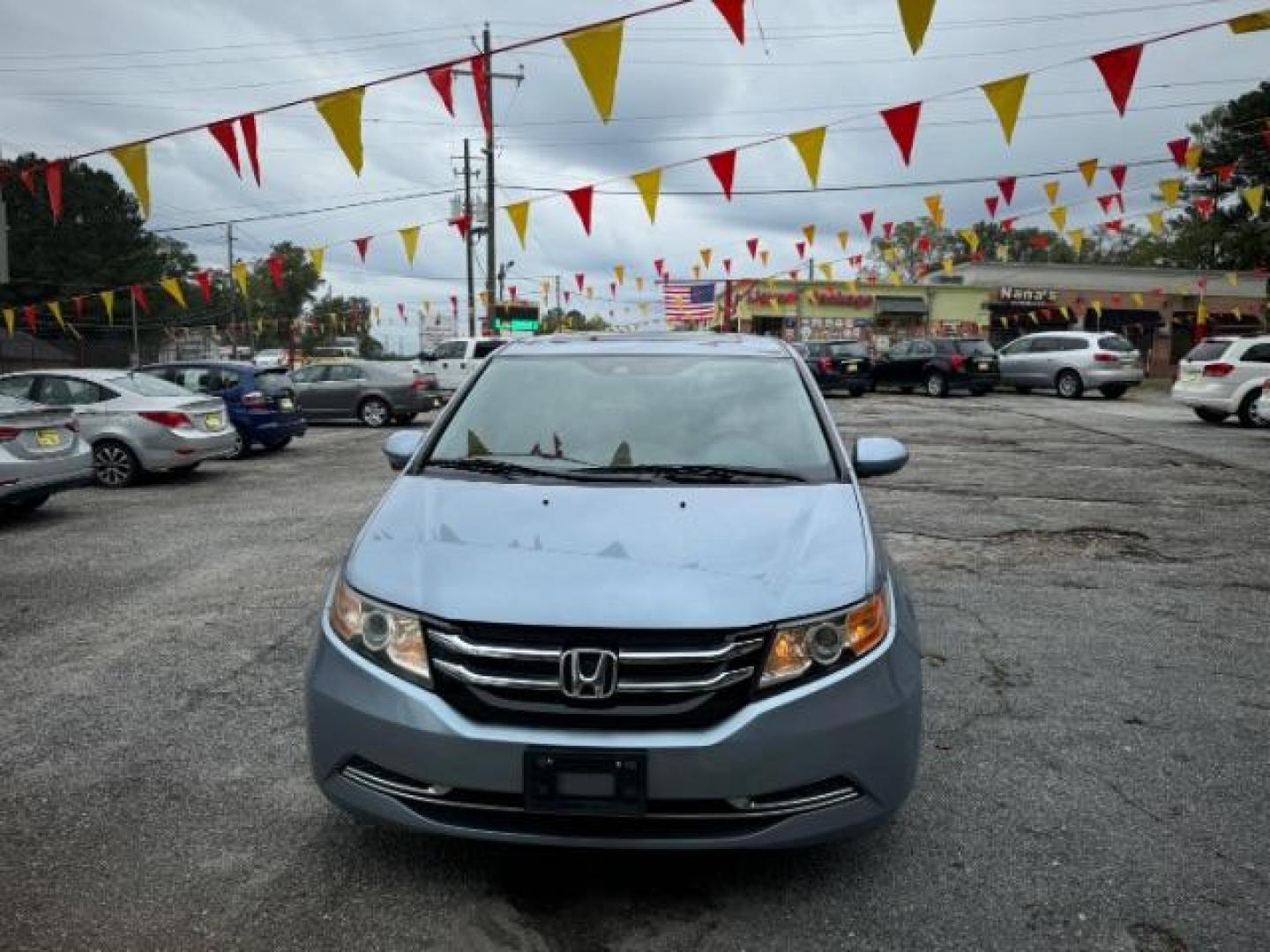 2014 Blue Honda Odyssey EX-L (5FNRL5H61EB) with an 3.5L V6 SOHC 24V engine, 6-Speed Automatic transmission, located at 1806 Veterans Memorial Hwy SW, Austell, GA, 30168, (770) 944-9558, 33.817959, -84.606987 - Photo#1