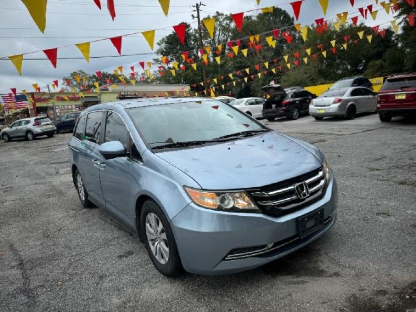 2014 Blue Honda Odyssey EX-L (5FNRL5H61EB) with an 3.5L V6 SOHC 24V engine, 6-Speed Automatic transmission, located at 1806 Veterans Memorial Hwy SW, Austell, GA, 30168, (770) 944-9558, 33.817959, -84.606987 - Photo#2