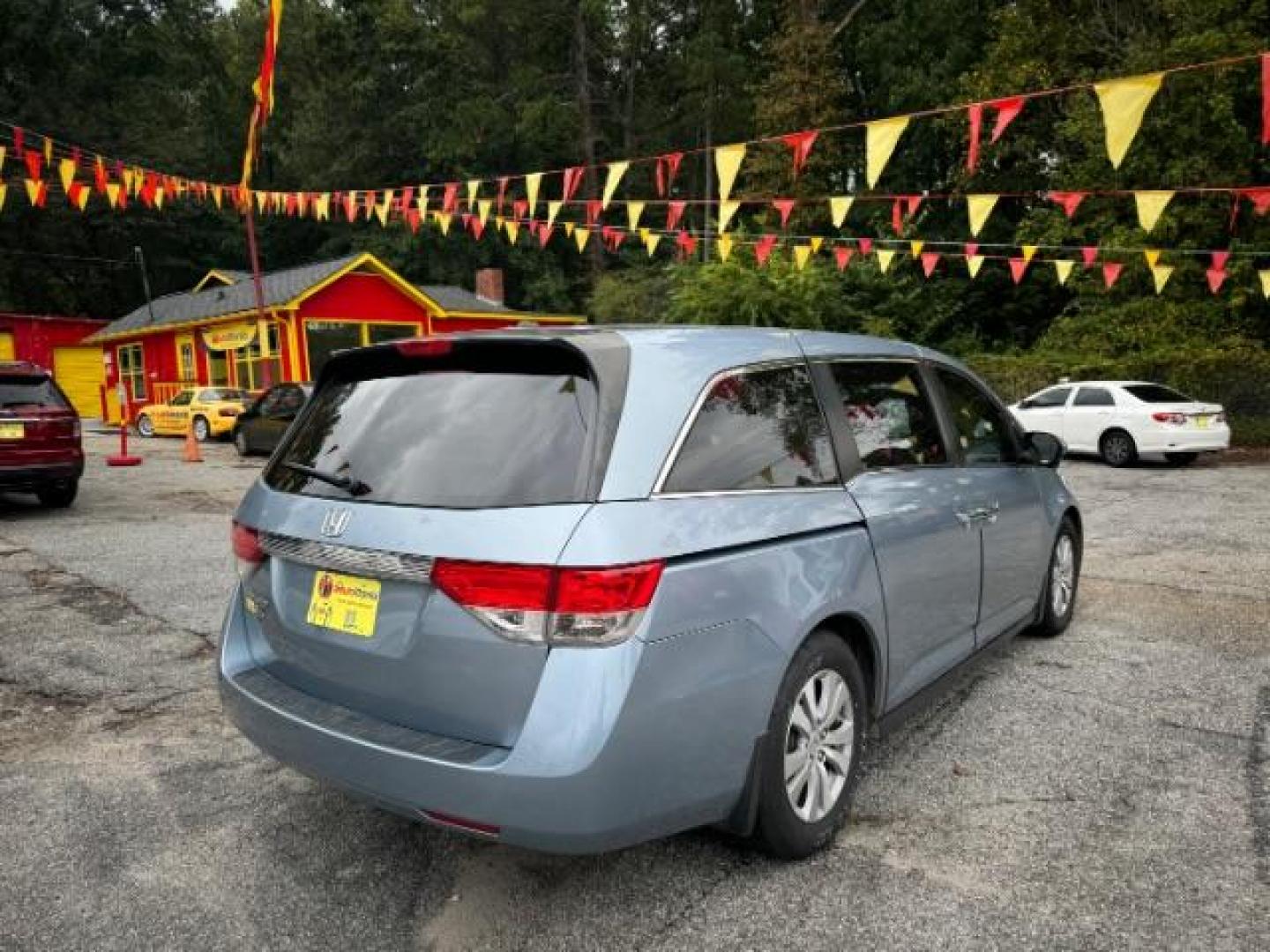 2014 Blue Honda Odyssey EX-L (5FNRL5H61EB) with an 3.5L V6 SOHC 24V engine, 6-Speed Automatic transmission, located at 1806 Veterans Memorial Hwy SW, Austell, GA, 30168, (770) 944-9558, 33.817959, -84.606987 - Photo#3