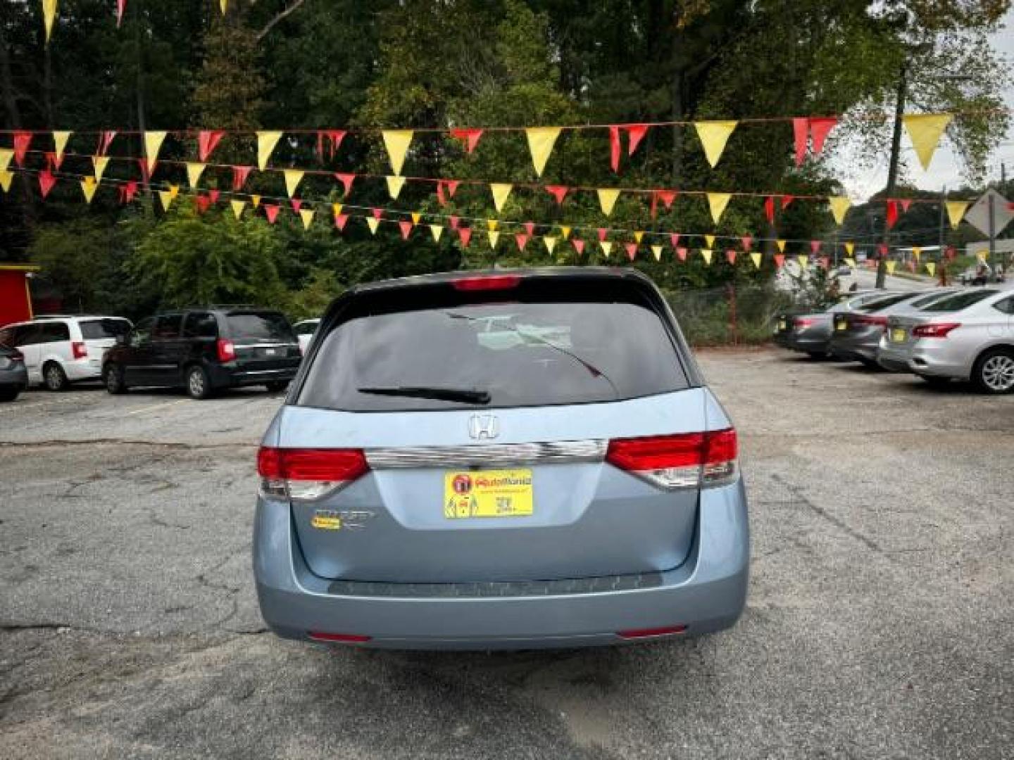 2014 Blue Honda Odyssey EX-L (5FNRL5H61EB) with an 3.5L V6 SOHC 24V engine, 6-Speed Automatic transmission, located at 1806 Veterans Memorial Hwy SW, Austell, GA, 30168, (770) 944-9558, 33.817959, -84.606987 - Photo#4