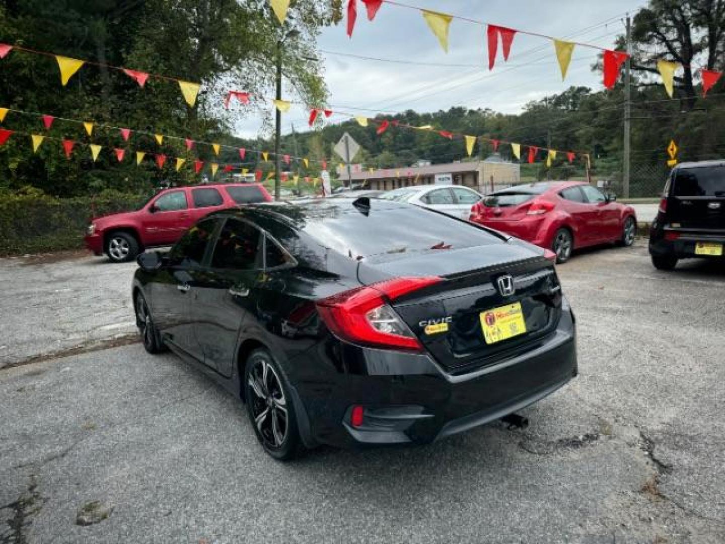 2016 Black Honda Civic Touring Sedan CVT (19XFC1F94GE) with an 1.5L L4 DOHC 16V TURBO engine, Continuously Variable Transmission transmission, located at 1806 Veterans Memorial Hwy SW, Austell, GA, 30168, (770) 944-9558, 33.817959, -84.606987 - Photo#16