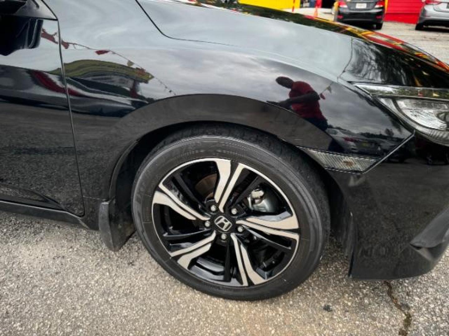 2016 Black Honda Civic Touring Sedan CVT (19XFC1F94GE) with an 1.5L L4 DOHC 16V TURBO engine, Continuously Variable Transmission transmission, located at 1806 Veterans Memorial Hwy SW, Austell, GA, 30168, (770) 944-9558, 33.817959, -84.606987 - Photo#18