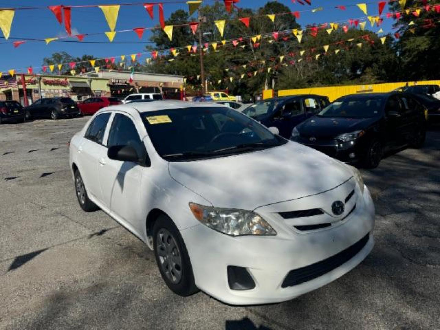 2013 White Toyota Corolla LE 4-Speed AT (JTDBU4EE4DJ) with an 1.8L L4 DOHC 16V engine, 4-Speed Automatic transmission, located at 1806 Veterans Memorial Hwy SW, Austell, GA, 30168, (770) 944-9558, 33.817959, -84.606987 - Photo#2