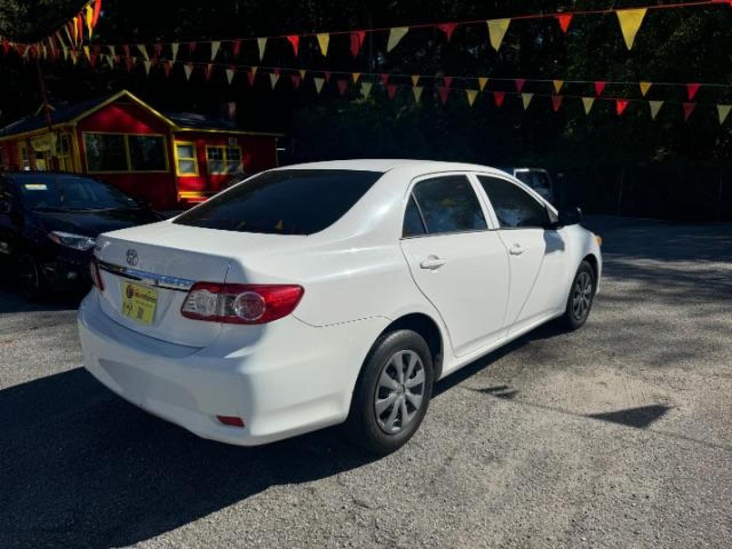 2013 White Toyota Corolla LE 4-Speed AT (JTDBU4EE4DJ) with an 1.8L L4 DOHC 16V engine, 4-Speed Automatic transmission, located at 1806 Veterans Memorial Hwy SW, Austell, GA, 30168, (770) 944-9558, 33.817959, -84.606987 - Photo#3