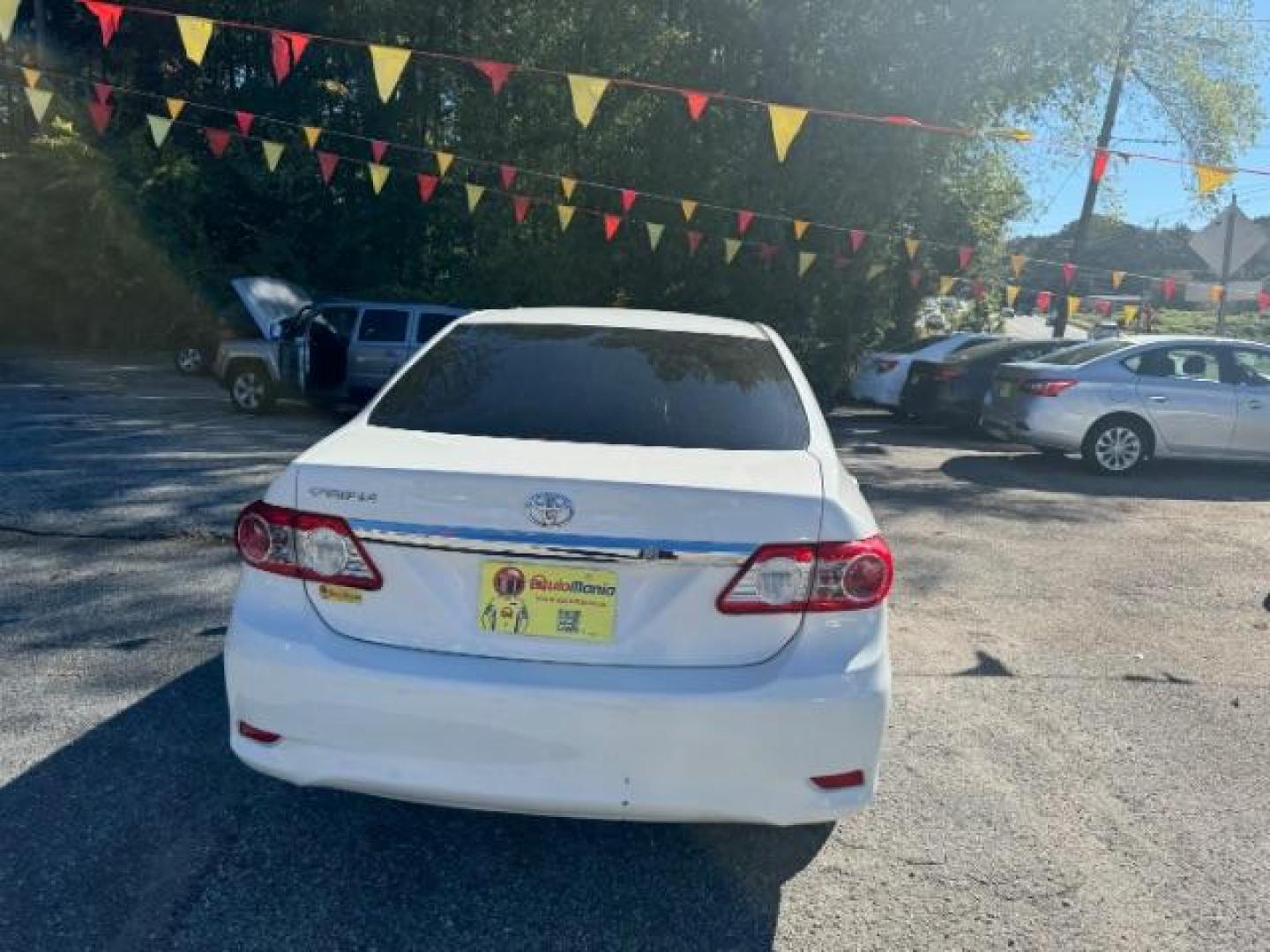 2013 White Toyota Corolla LE 4-Speed AT (JTDBU4EE4DJ) with an 1.8L L4 DOHC 16V engine, 4-Speed Automatic transmission, located at 1806 Veterans Memorial Hwy SW, Austell, GA, 30168, (770) 944-9558, 33.817959, -84.606987 - Photo#4