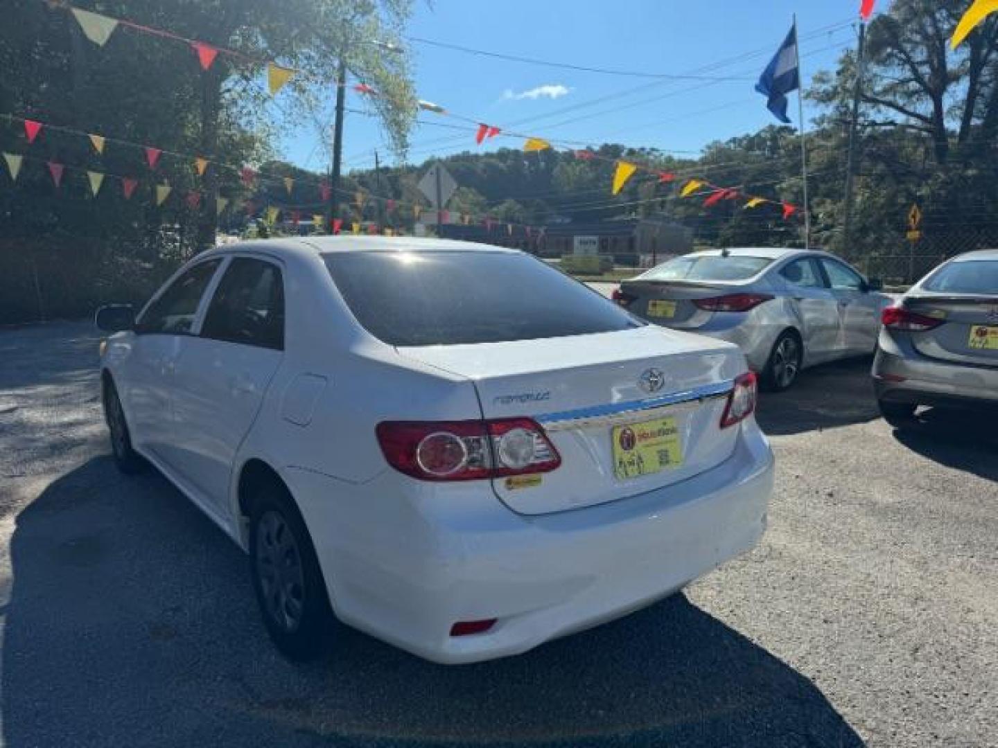 2013 White Toyota Corolla LE 4-Speed AT (JTDBU4EE4DJ) with an 1.8L L4 DOHC 16V engine, 4-Speed Automatic transmission, located at 1806 Veterans Memorial Hwy SW, Austell, GA, 30168, (770) 944-9558, 33.817959, -84.606987 - Photo#5