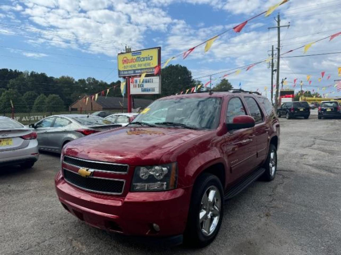 2014 Red Chevrolet Tahoe LT 2WD (1GNSCBE03ER) with an 5.3L V8 OHV 16V FFV engine, 6-Speed Automatic transmission, located at 1806 Veterans Memorial Hwy SW, Austell, GA, 30168, (770) 944-9558, 33.817959, -84.606987 - Photo#0