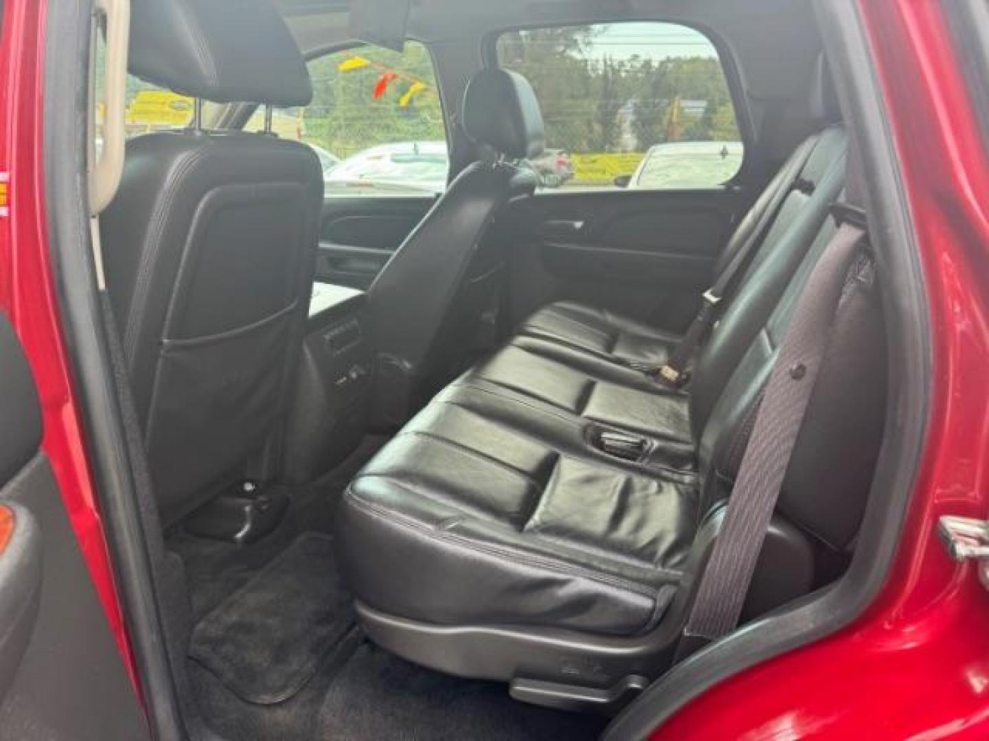 2014 Red Chevrolet Tahoe LT 2WD (1GNSCBE03ER) with an 5.3L V8 OHV 16V FFV engine, 6-Speed Automatic transmission, located at 1806 Veterans Memorial Hwy SW, Austell, GA, 30168, (770) 944-9558, 33.817959, -84.606987 - Photo#9