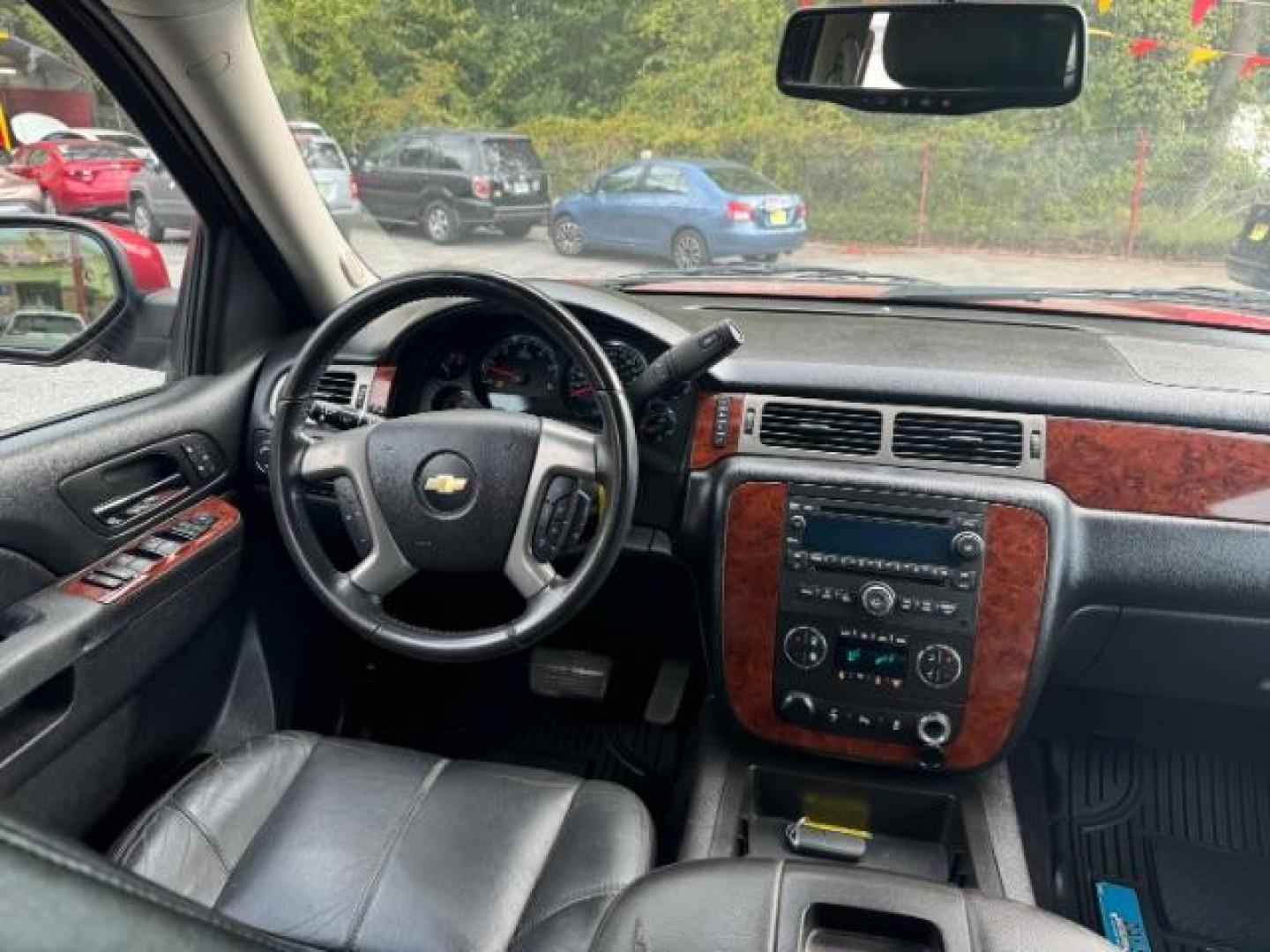 2014 Red Chevrolet Tahoe LT 2WD (1GNSCBE03ER) with an 5.3L V8 OHV 16V FFV engine, 6-Speed Automatic transmission, located at 1806 Veterans Memorial Hwy SW, Austell, GA, 30168, (770) 944-9558, 33.817959, -84.606987 - Photo#12