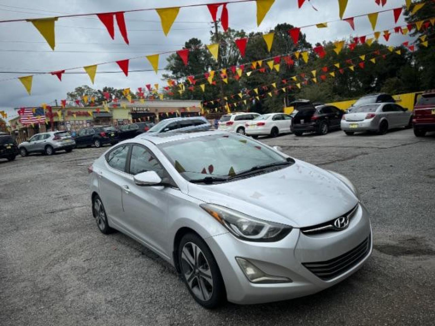 2014 Silver Hyundai Elantra GLS A/T (KMHDH4AHXEU) with an 2.0L L4 DOHC 16V engine, 6-Speed Automatic transmission, located at 1806 Veterans Memorial Hwy SW, Austell, GA, 30168, (770) 944-9558, 33.817959, -84.606987 - Photo#2