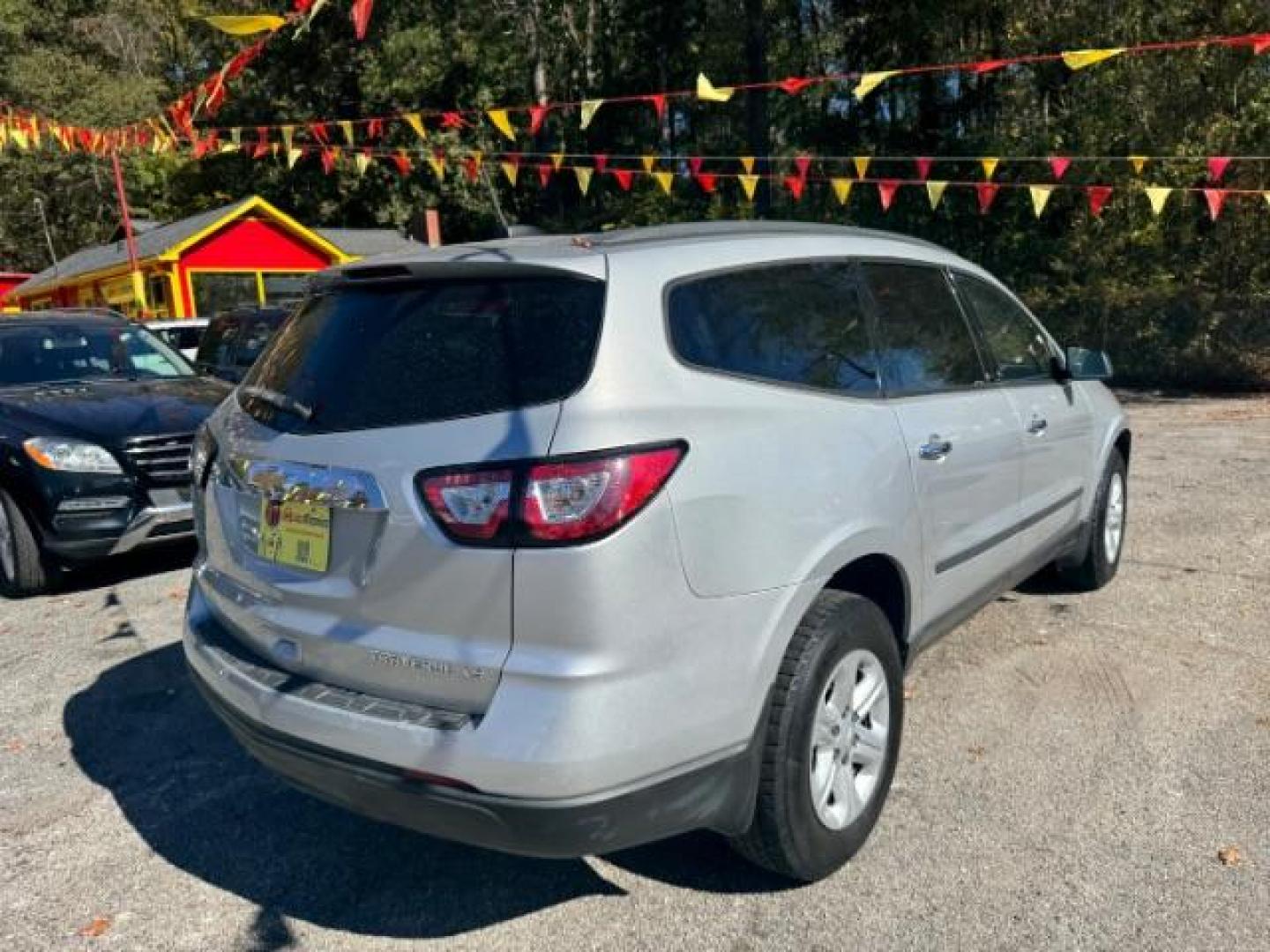 2016 Silver Chevrolet Traverse LS FWD w/PDC (1GNKRFED9GJ) with an 3.6L V6 DOHC 24V engine, 6-Speed Automatic transmission, located at 1806 Veterans Memorial Hwy SW, Austell, GA, 30168, (770) 944-9558, 33.817959, -84.606987 - Photo#5