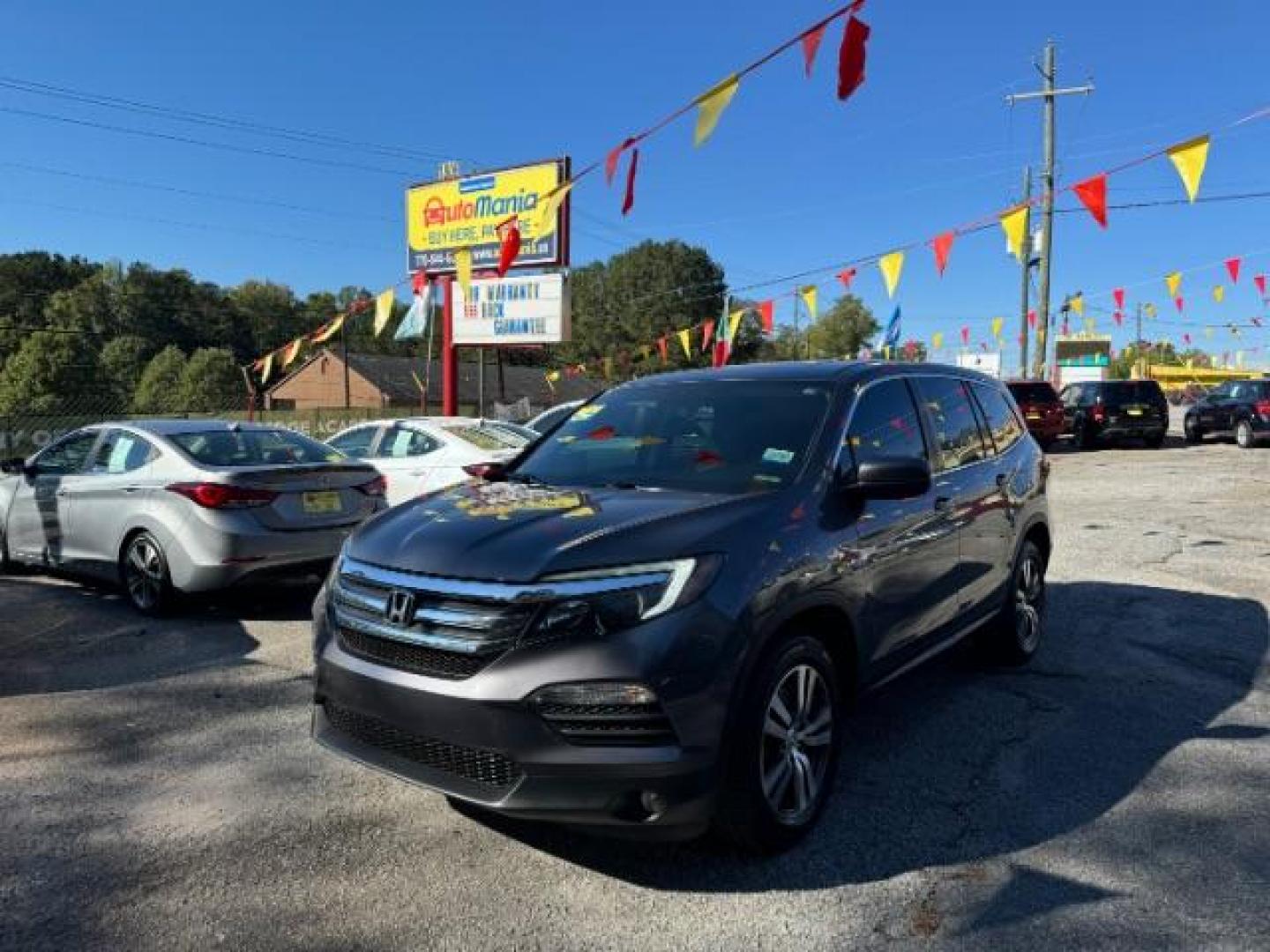 2017 Gray Honda Pilot EXL 2WD (5FNYF5H50HB) with an 3.5L V6 SOHC 24V engine, 6-Speed Automatic transmission, located at 1806 Veterans Memorial Hwy SW, Austell, GA, 30168, (770) 944-9558, 33.817959, -84.606987 - Photo#0