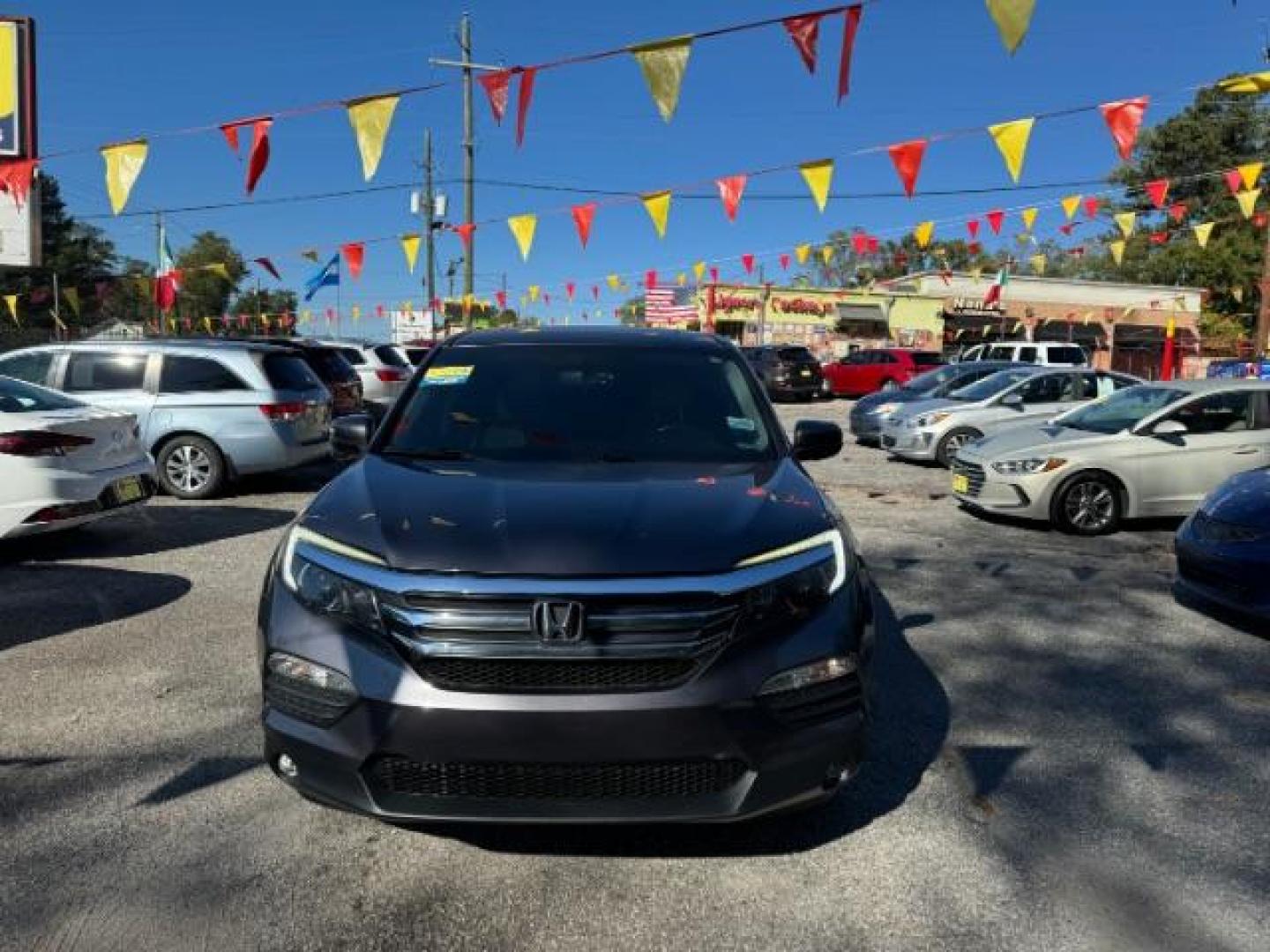 2017 Gray Honda Pilot EXL 2WD (5FNYF5H50HB) with an 3.5L V6 SOHC 24V engine, 6-Speed Automatic transmission, located at 1806 Veterans Memorial Hwy SW, Austell, GA, 30168, (770) 944-9558, 33.817959, -84.606987 - Photo#1