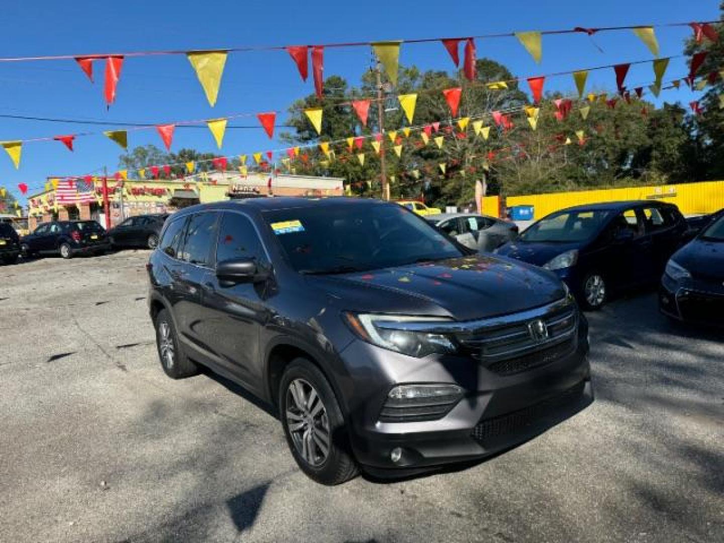 2017 Gray Honda Pilot EXL 2WD (5FNYF5H50HB) with an 3.5L V6 SOHC 24V engine, 6-Speed Automatic transmission, located at 1806 Veterans Memorial Hwy SW, Austell, GA, 30168, (770) 944-9558, 33.817959, -84.606987 - Photo#2