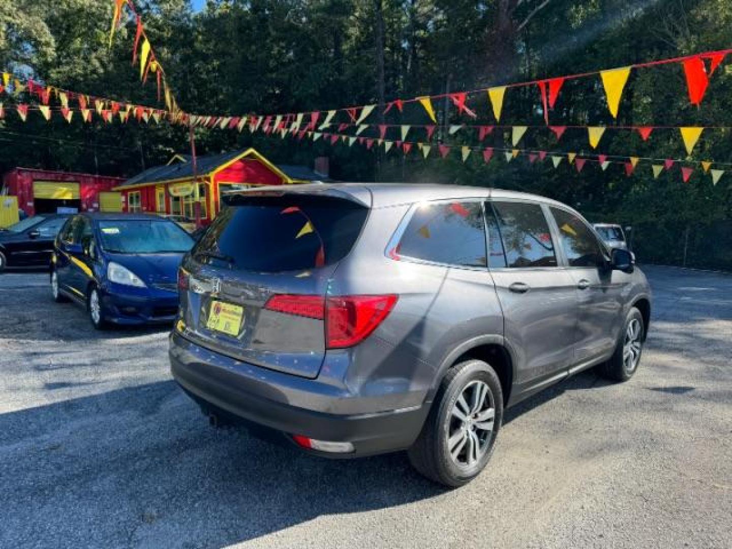 2017 Gray Honda Pilot EXL 2WD (5FNYF5H50HB) with an 3.5L V6 SOHC 24V engine, 6-Speed Automatic transmission, located at 1806 Veterans Memorial Hwy SW, Austell, GA, 30168, (770) 944-9558, 33.817959, -84.606987 - Photo#3