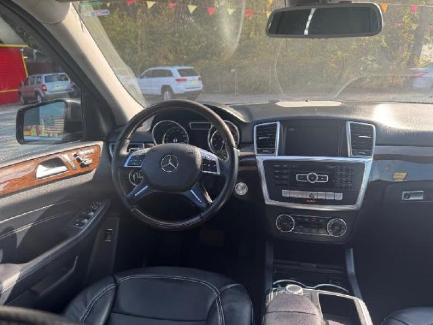 2014 Black Mercedes-Benz M-Class ML350 4MATIC (4JGDA5JB5EA) with an 3.5L V6 DOHC 24V engine, 7-Speed Automatic transmission, located at 1806 Veterans Memorial Hwy SW, Austell, GA, 30168, (770) 944-9558, 33.817959, -84.606987 - Photo#11