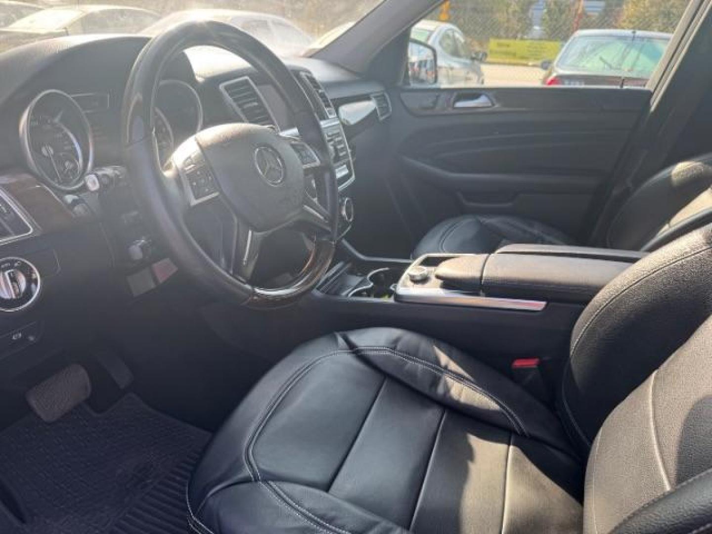 2014 Black Mercedes-Benz M-Class ML350 4MATIC (4JGDA5JB5EA) with an 3.5L V6 DOHC 24V engine, 7-Speed Automatic transmission, located at 1806 Veterans Memorial Hwy SW, Austell, GA, 30168, (770) 944-9558, 33.817959, -84.606987 - Photo#16