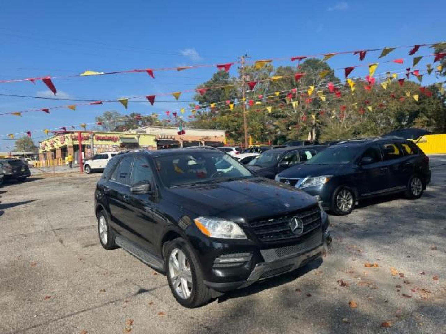 2014 Black Mercedes-Benz M-Class ML350 4MATIC (4JGDA5JB5EA) with an 3.5L V6 DOHC 24V engine, 7-Speed Automatic transmission, located at 1806 Veterans Memorial Hwy SW, Austell, GA, 30168, (770) 944-9558, 33.817959, -84.606987 - Photo#2