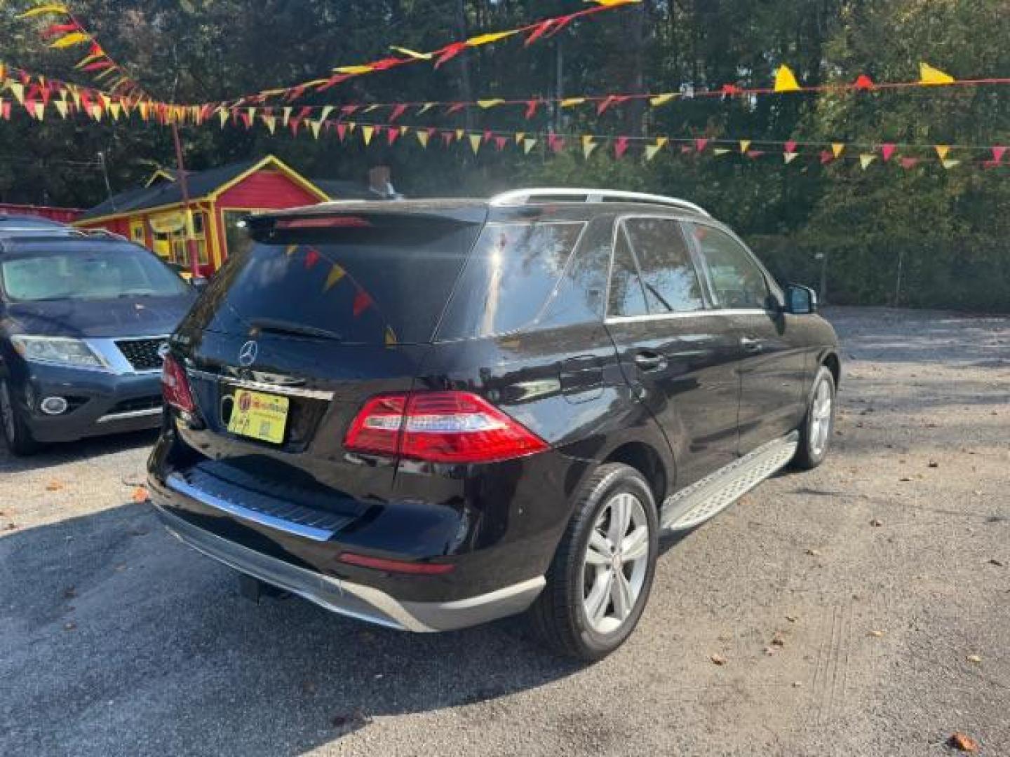 2014 Black Mercedes-Benz M-Class ML350 4MATIC (4JGDA5JB5EA) with an 3.5L V6 DOHC 24V engine, 7-Speed Automatic transmission, located at 1806 Veterans Memorial Hwy SW, Austell, GA, 30168, (770) 944-9558, 33.817959, -84.606987 - Photo#3