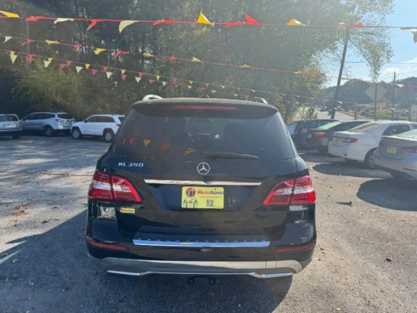 2014 Black Mercedes-Benz M-Class ML350 4MATIC (4JGDA5JB5EA) with an 3.5L V6 DOHC 24V engine, 7-Speed Automatic transmission, located at 1806 Veterans Memorial Hwy SW, Austell, GA, 30168, (770) 944-9558, 33.817959, -84.606987 - Photo#4