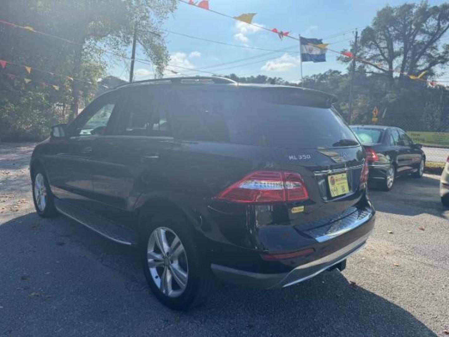 2014 Black Mercedes-Benz M-Class ML350 4MATIC (4JGDA5JB5EA) with an 3.5L V6 DOHC 24V engine, 7-Speed Automatic transmission, located at 1806 Veterans Memorial Hwy SW, Austell, GA, 30168, (770) 944-9558, 33.817959, -84.606987 - Photo#5