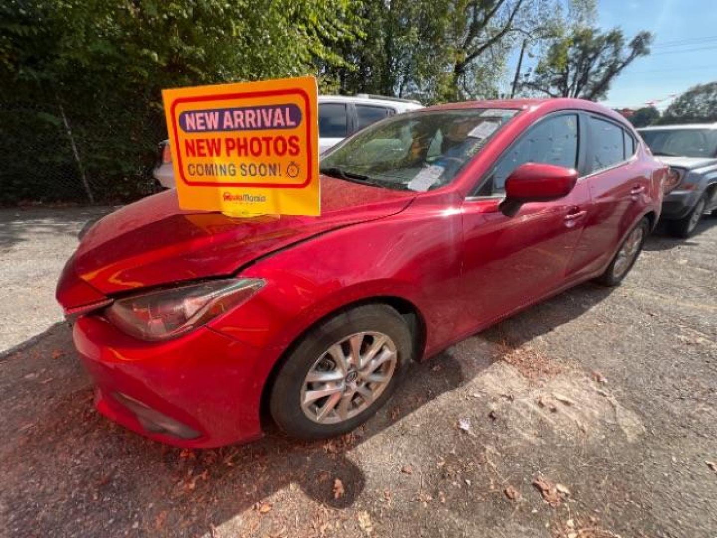 2015 Red Mazda MAZDA3 i Grand Touring AT 4-Door (3MZBM1W76FM) with an 2.0L L4 DOHC 16V engine, 6-Speed Automatic transmission, located at 1806 Veterans Memorial Hwy SW, Austell, GA, 30168, (770) 944-9558, 33.817959, -84.606987 - Photo#0