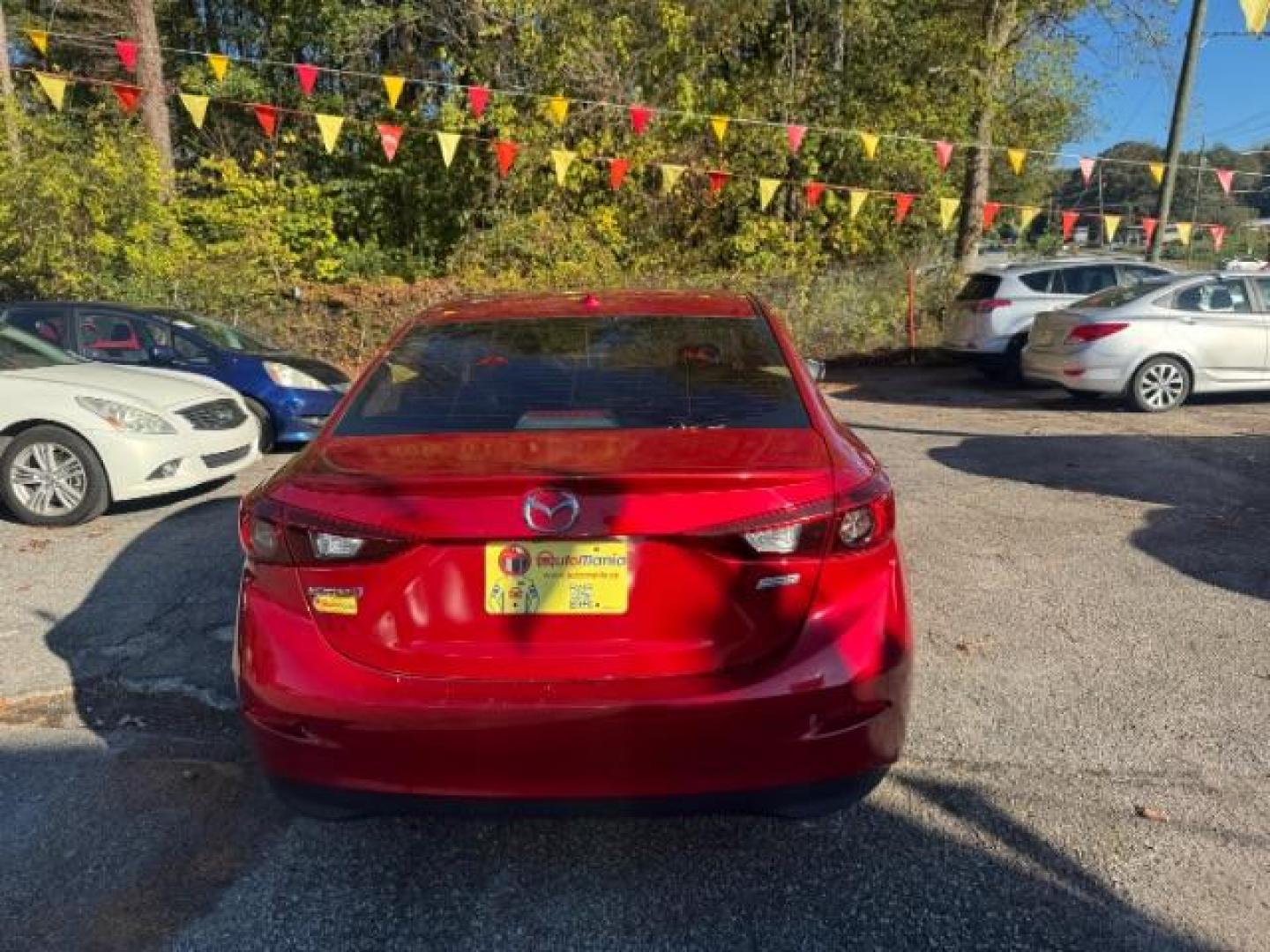 2015 Red Mazda MAZDA3 i Grand Touring AT 4-Door (3MZBM1W76FM) with an 2.0L L4 DOHC 16V engine, 6-Speed Automatic transmission, located at 1806 Veterans Memorial Hwy SW, Austell, GA, 30168, (770) 944-9558, 33.817959, -84.606987 - Photo#4