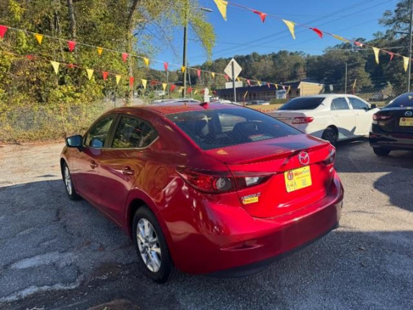 2015 Red Mazda MAZDA3 i Grand Touring AT 4-Door (3MZBM1W76FM) with an 2.0L L4 DOHC 16V engine, 6-Speed Automatic transmission, located at 1806 Veterans Memorial Hwy SW, Austell, GA, 30168, (770) 944-9558, 33.817959, -84.606987 - Photo#5